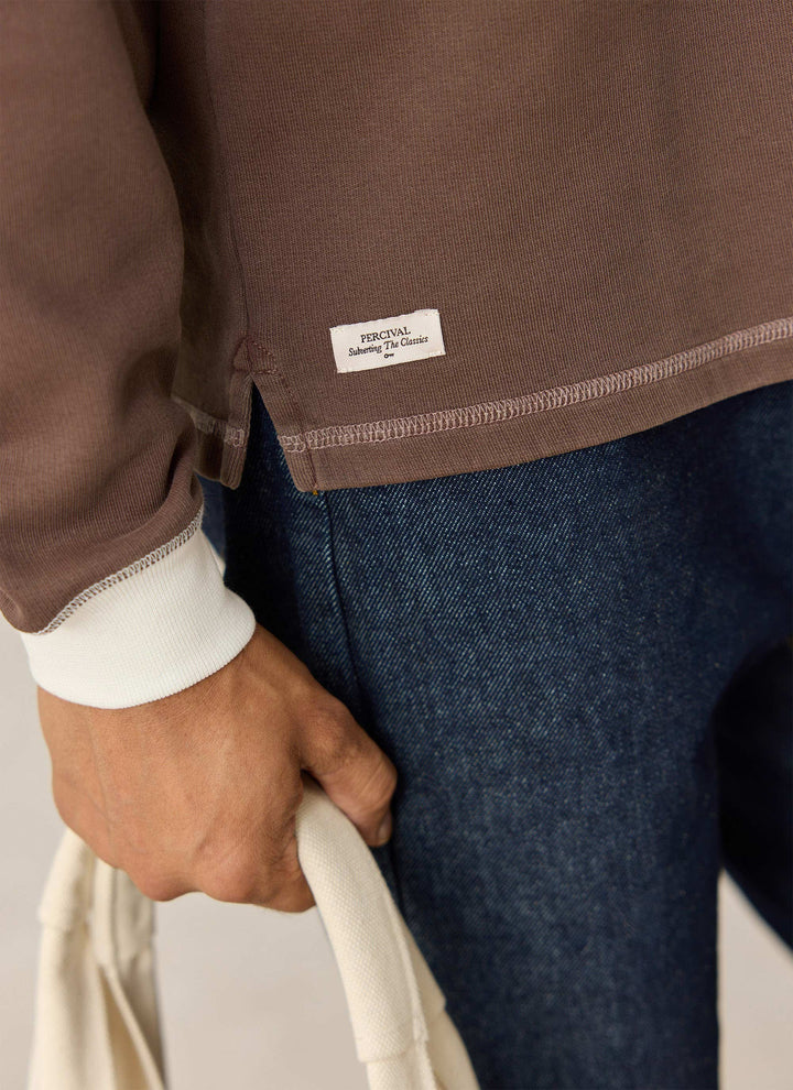 Percival brown rugby polo hem label and cuff detail