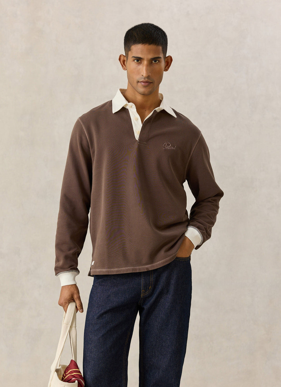Percival Editor rugby polo in brown with cream collar on model